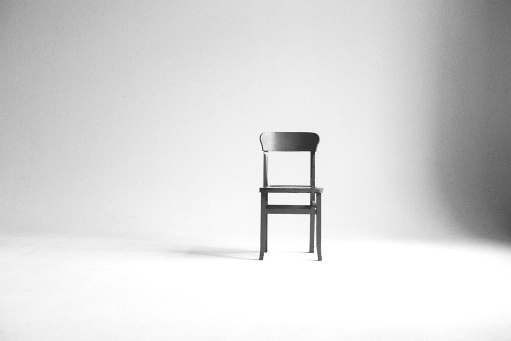 Wooden Chair on a White Wall Studio 